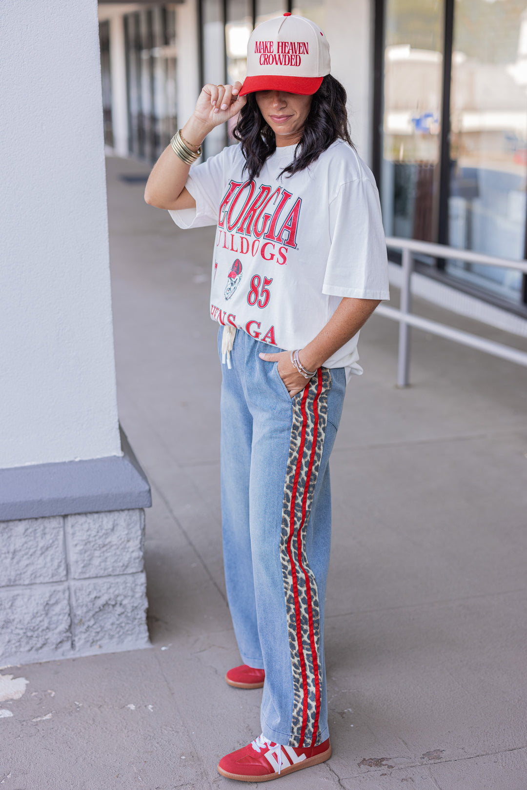 Women's blue denim wide leg pants with red ribbon and brown leopard print sides by Easel showing full side view