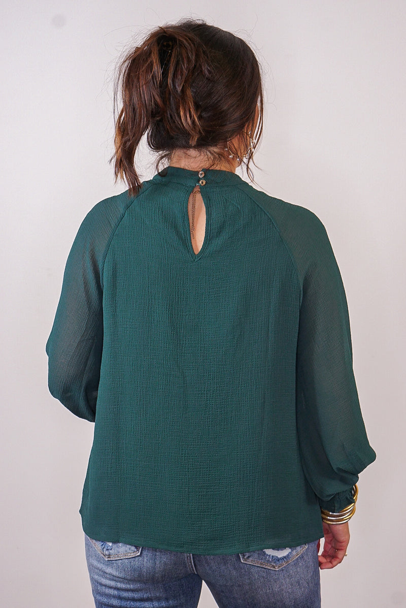 green ruffle entro top