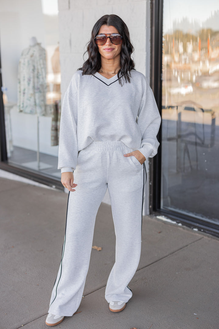 Women's grey and black striped piping scuba knit top by Rae Mode showing full front view