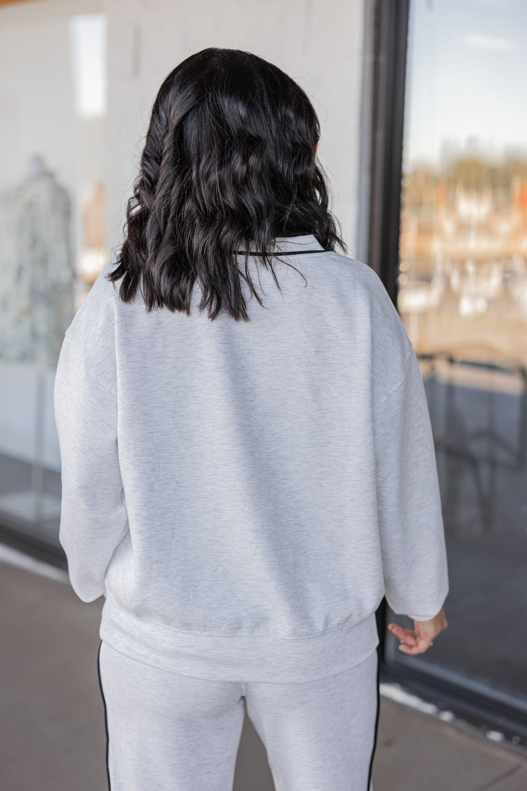 Women's grey and black striped piping scuba knit top by Rae Mode showing up close back view