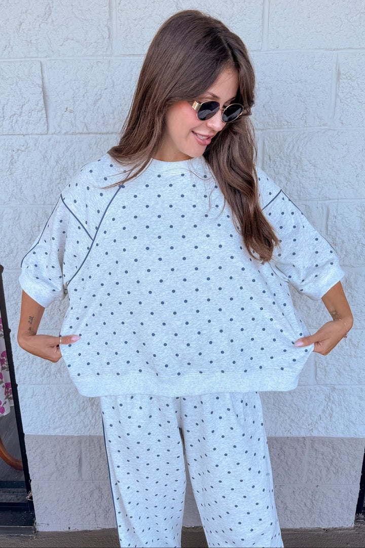 washed heather grey with navy polka dot print short sleeve relaxed silhouette terry knit top