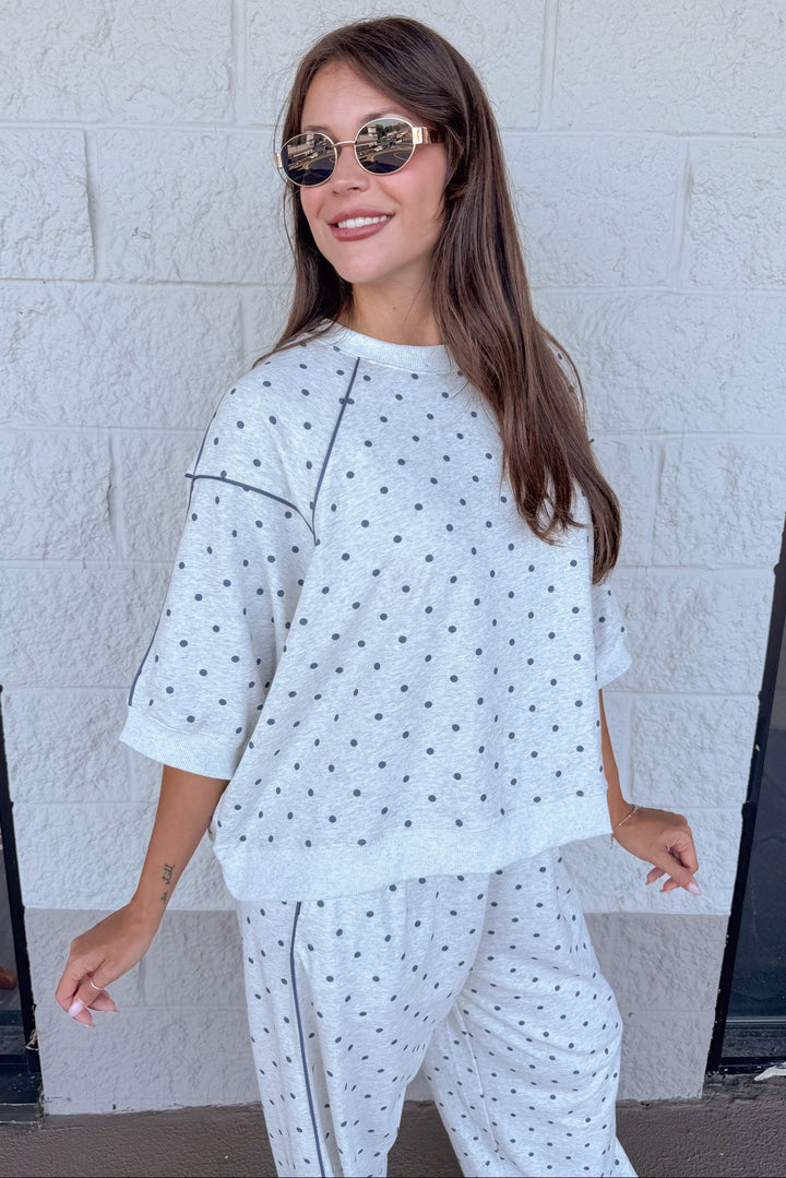 washed heather grey with navy polka dot print drop shoulder short sleeve terry knit top