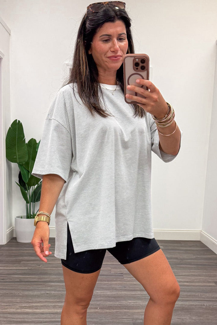heather grey and white striped short sleeve oversized fit knit top with side slits at hem
