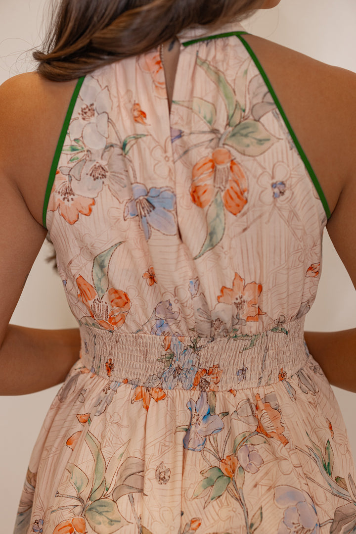 Women's blush floral print midi dress with green stripes and a tulip hem by Entro showing up close back view