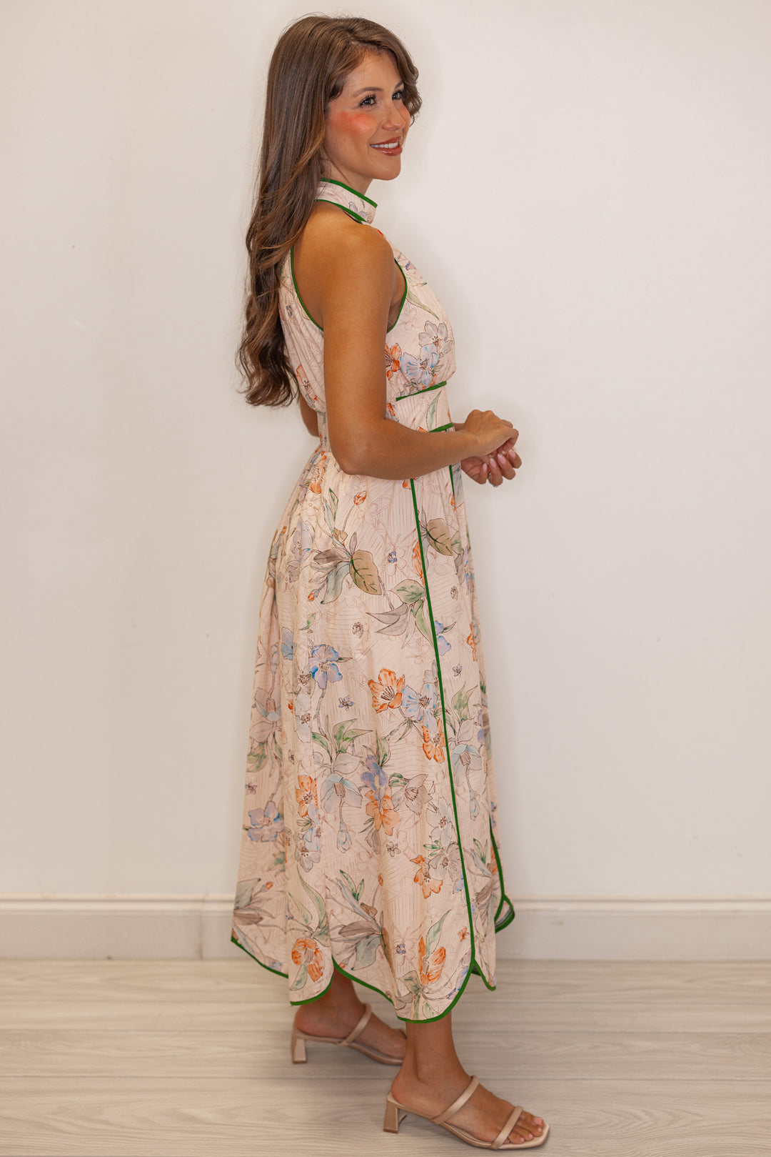 Women's blush floral print midi dress with green stripes and a tulip hem by Entro showing full side view