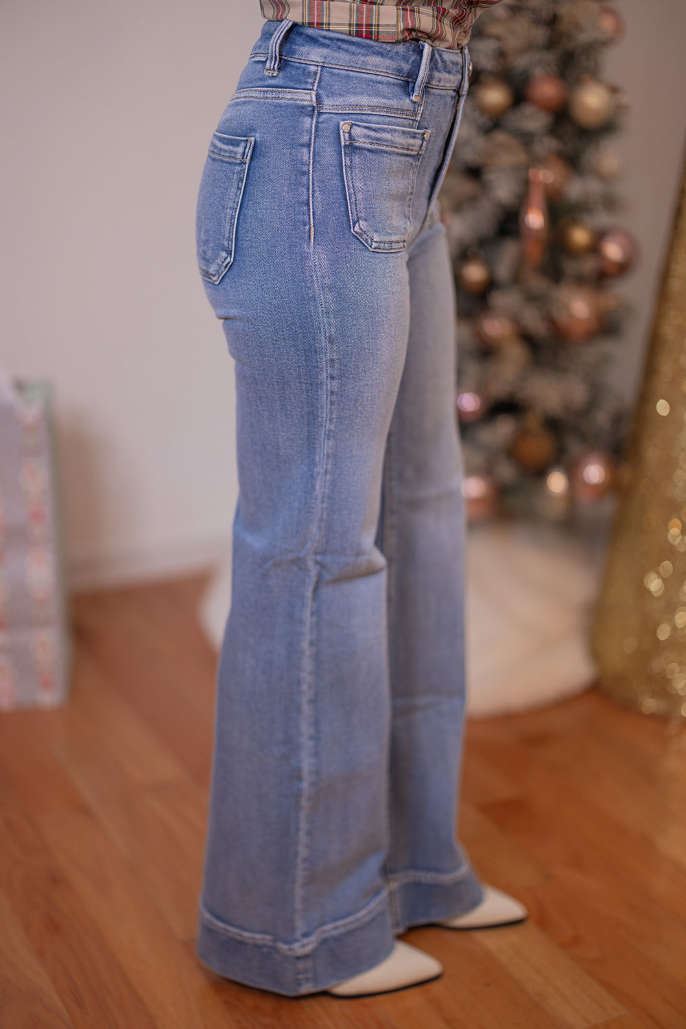 Risen Jeans medium washed denim flare jeans with patch pockets showing side view