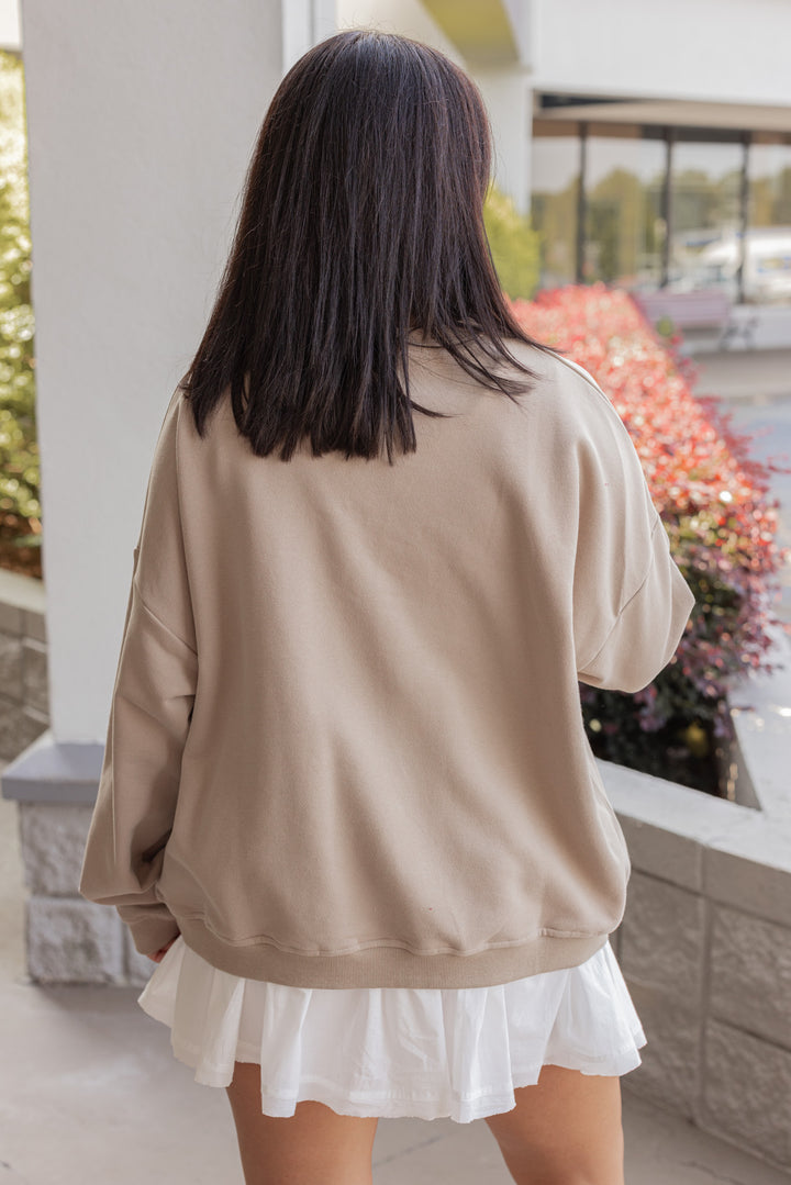 Women's taupe terry knit pullover sweatshirt with a white horseshoe on front by Wishlist showing up close back view