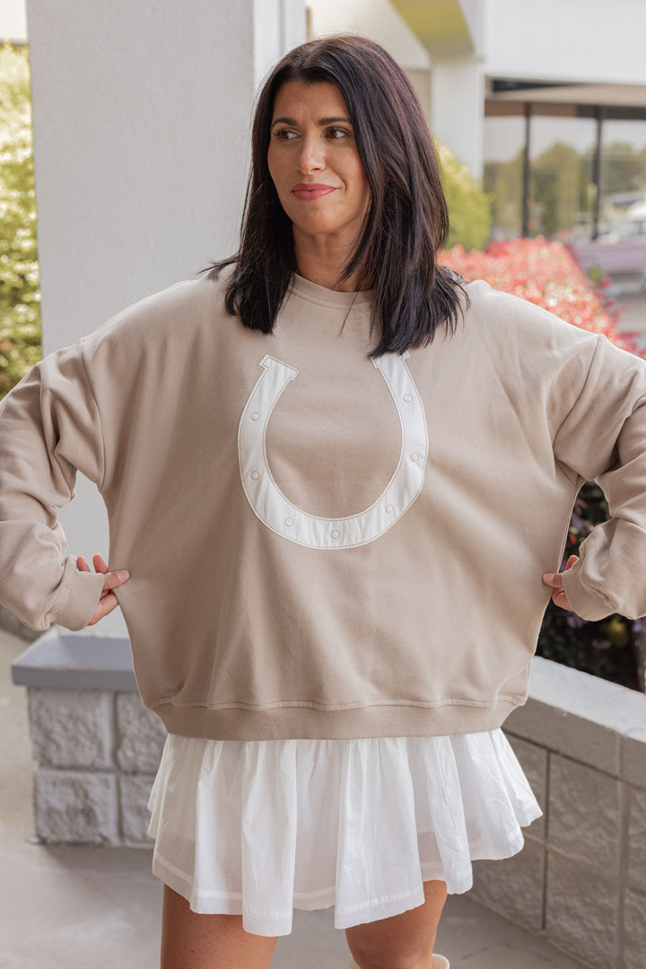 Women's taupe terry knit pullover sweatshirt with a white horseshoe on front by Wishlist showing relaxed fit