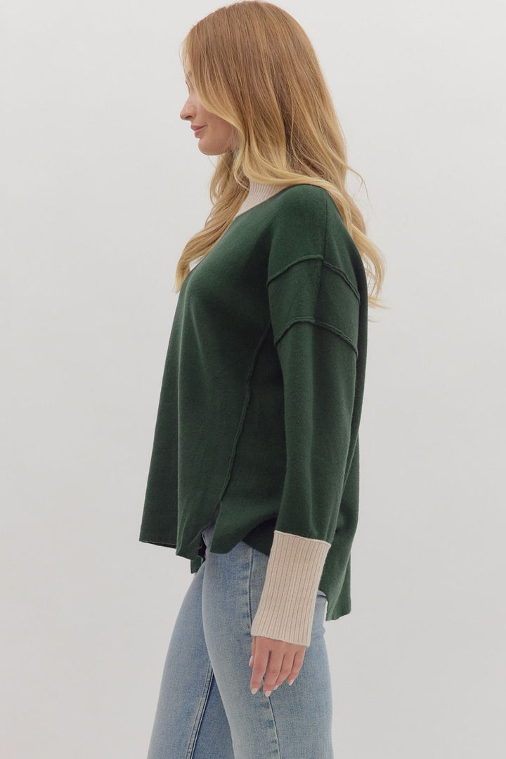Women's hunter green sweater knit pullover top with cream ribbed trim by Entro showing side view