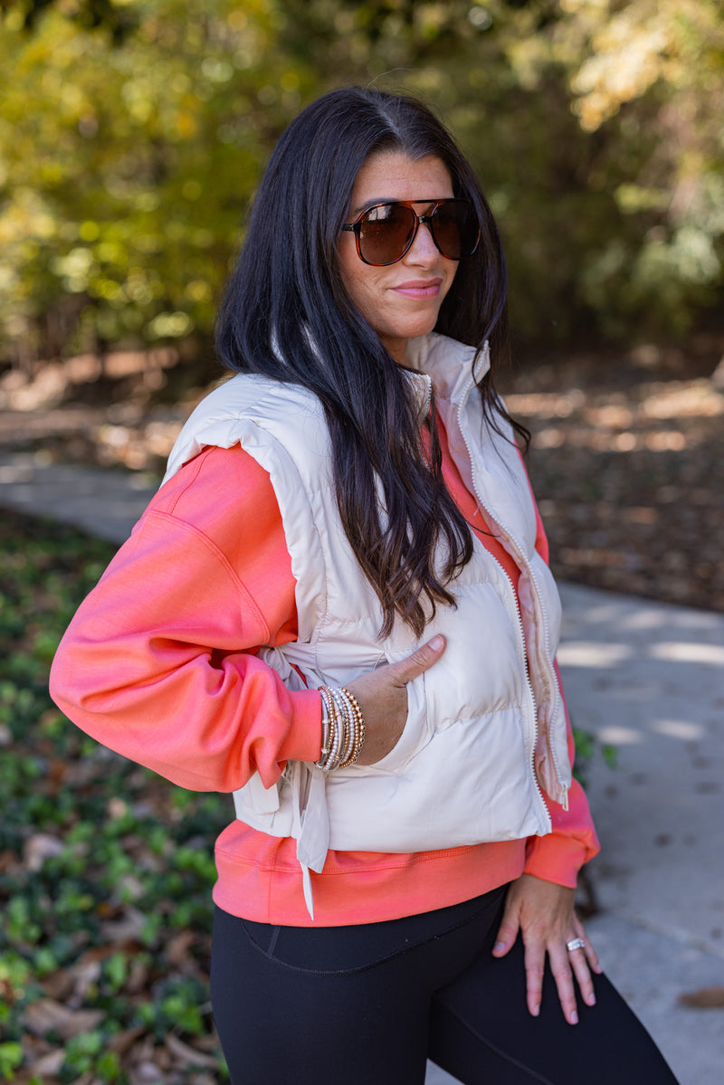 cropped ivory bow puffer vest