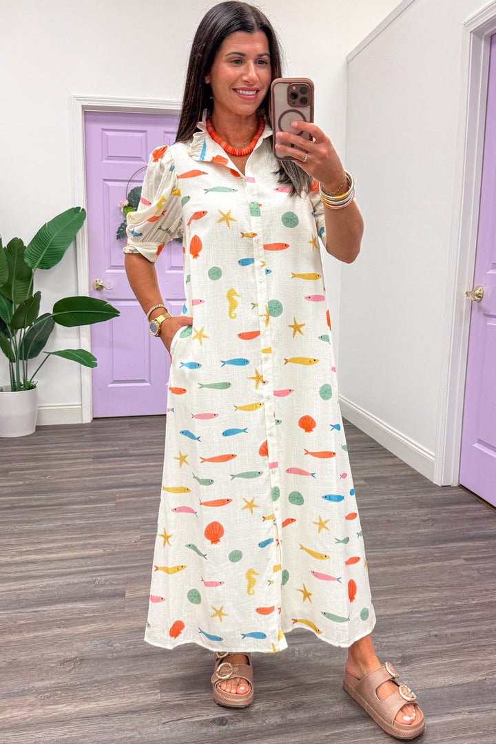 ivory with multicolored fish and seashell print short sleeve button front maxi dress