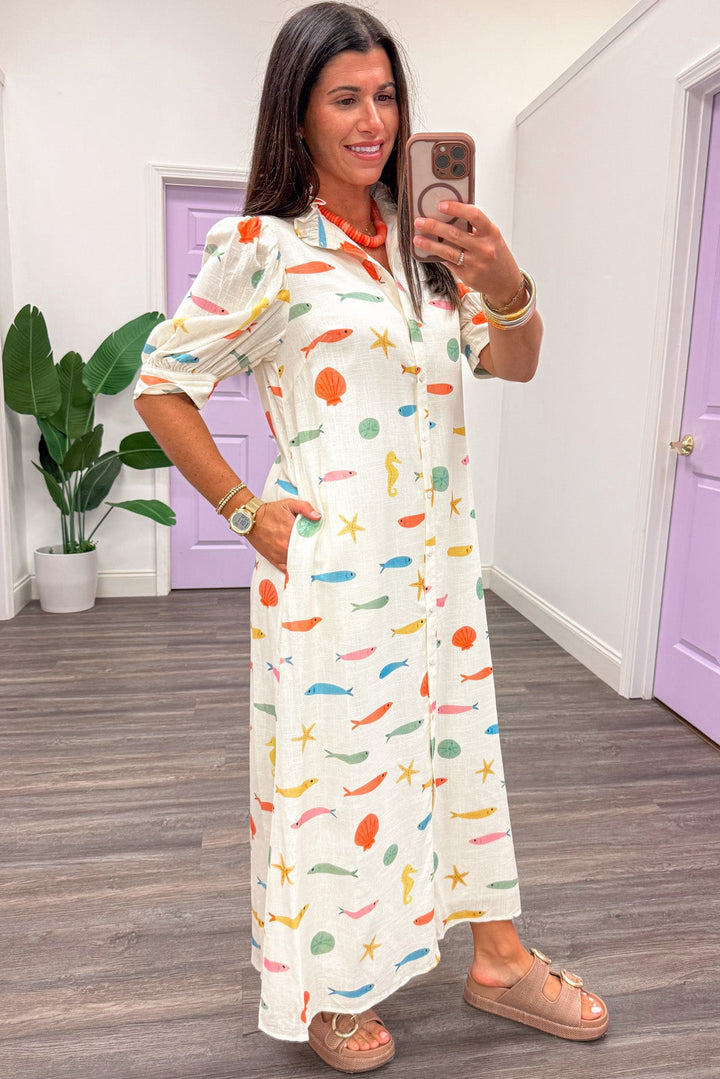 ivory with multicolored fish and seashell print button front maxi dress with side pockets
