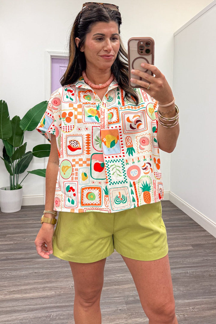 ivory with bright multi-colored fruit basket print short sleeve v neck cotton top