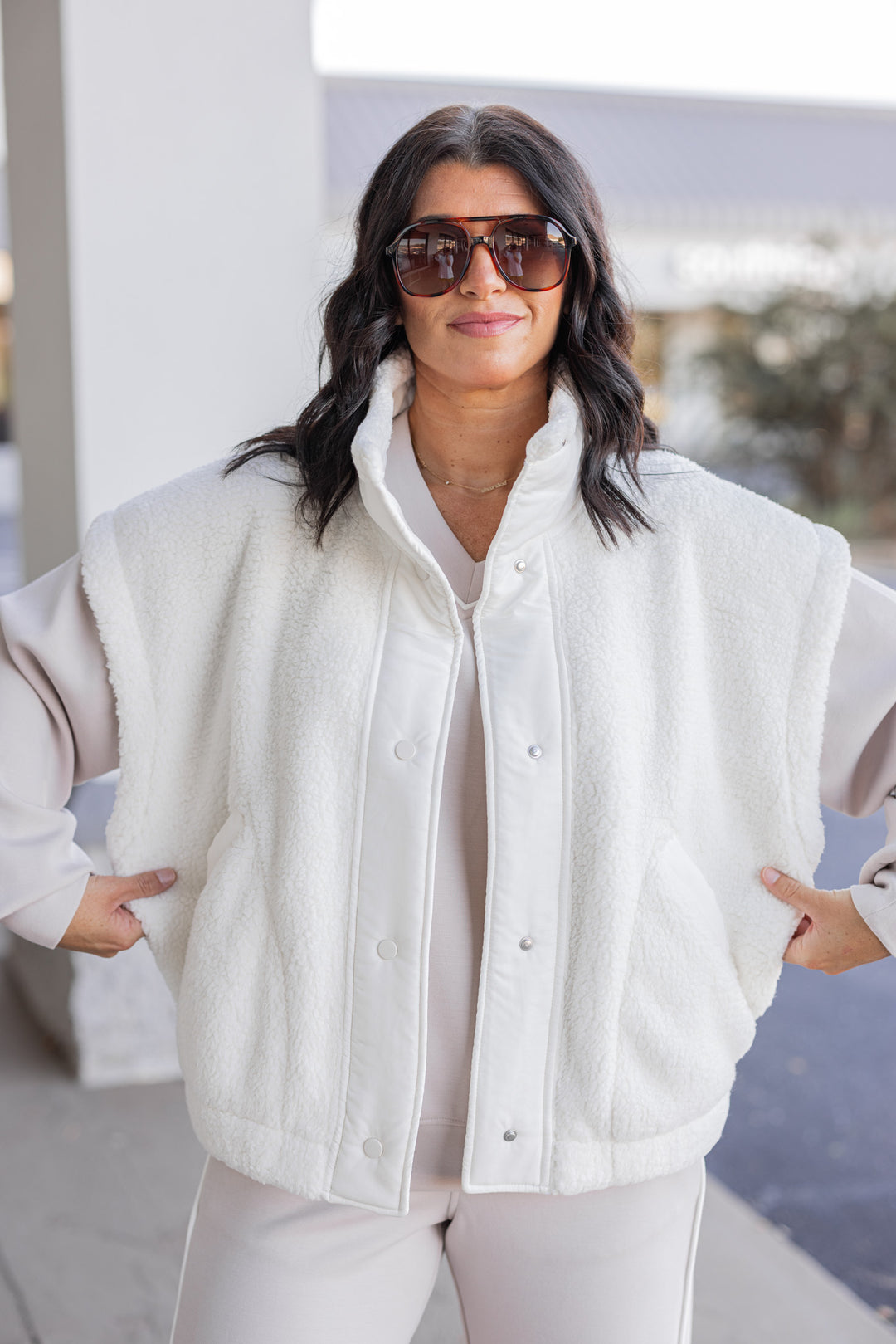 Women's ivory sherpa vest by Rae Mode showing relaxed fit