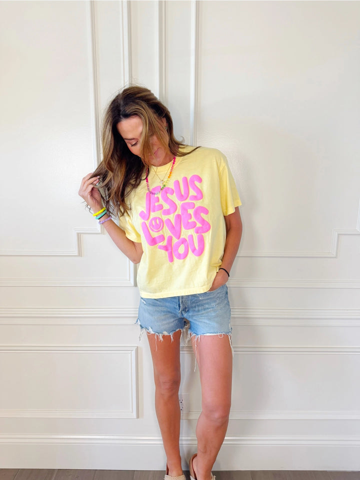 jesus loves you puff print yellow graphic tee