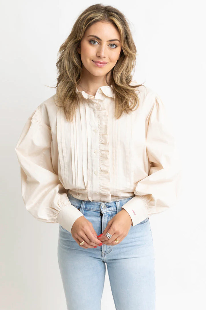 Women's ivory button front top with ruffle trim details by Karlie