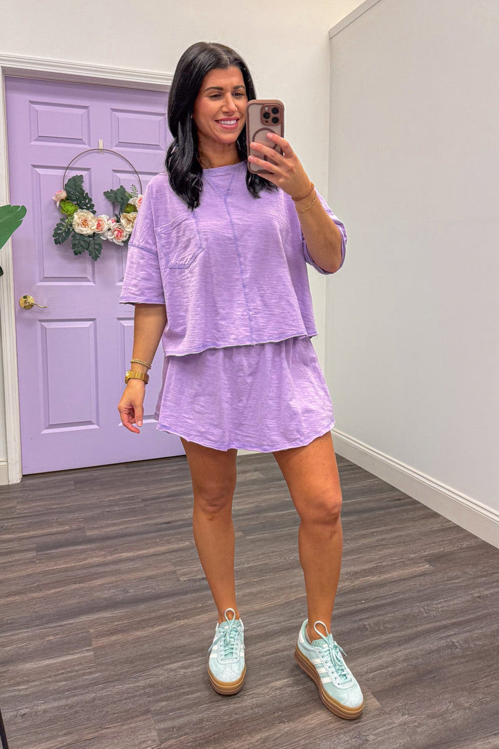 Women's lavender athleisure skort set paired with sneakers