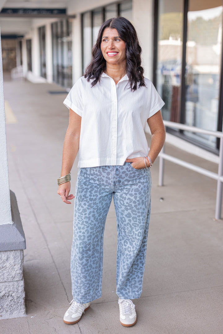 Washed blue and black leopard print barrel denim pants by Entro showing full front view