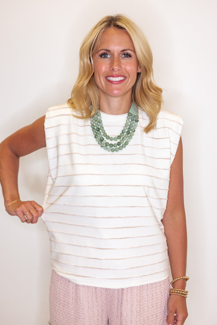 Cream sleeveless knit top with ombre taupe textured wave stripes by Strut and Bolt showing relaxed fit