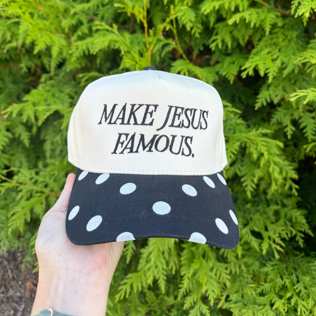 Women's "Make Jesus Famous" trucker hat with black and cream polka dot bill by Poppy And Pine