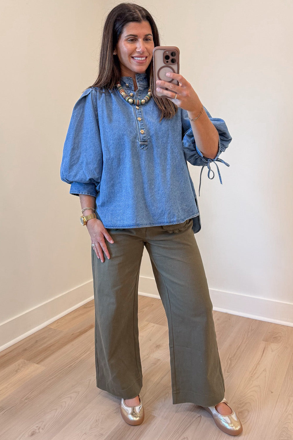 solid medium blue denim button front bodice 3/4 length puff sleeve top with rounded bottom hem