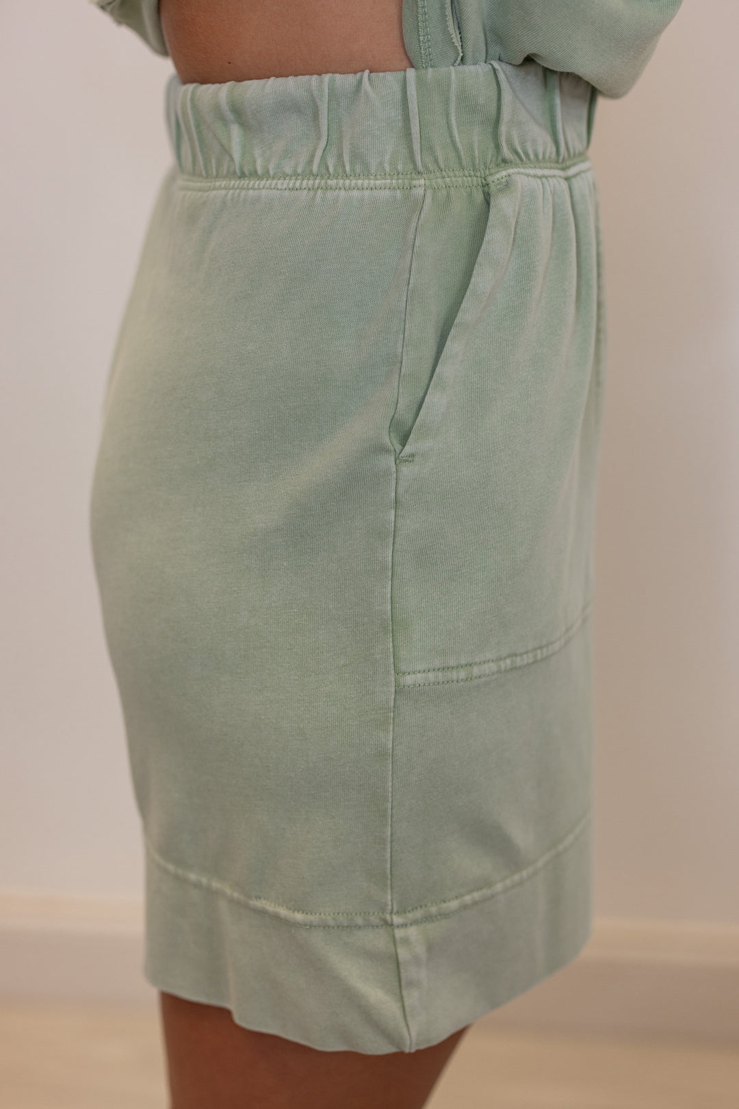 Women's mineral washed mint latte green knit elastic waist shorts by Rae Mode showing side view