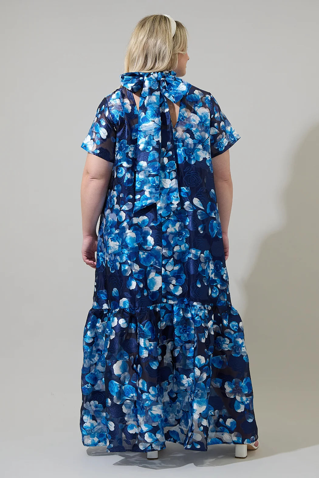 Plus size navy and blue maxi dress with textured floral print in a flattering silhouette