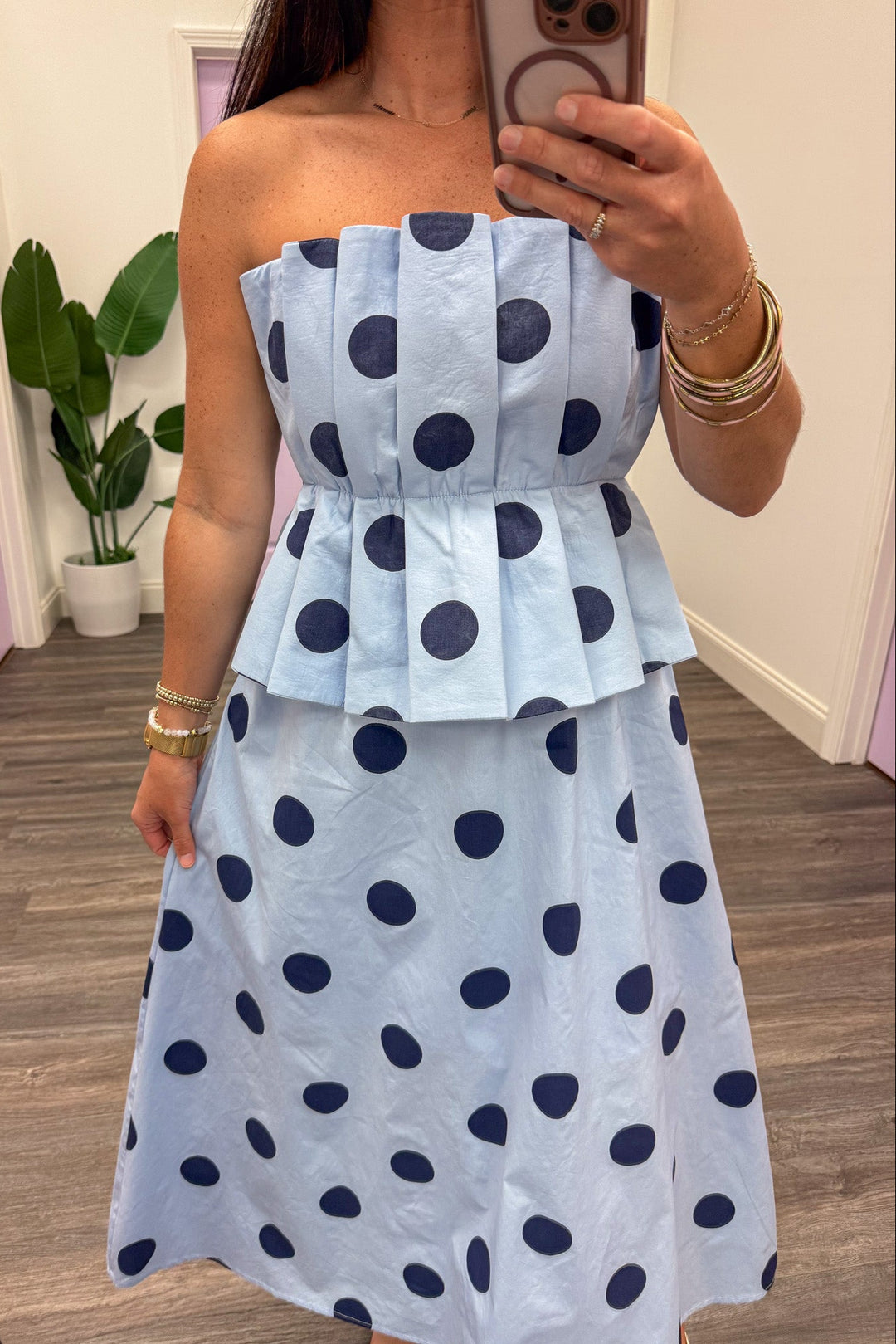 light blue with large navy polka dot print pleated peplum strapless midi dress