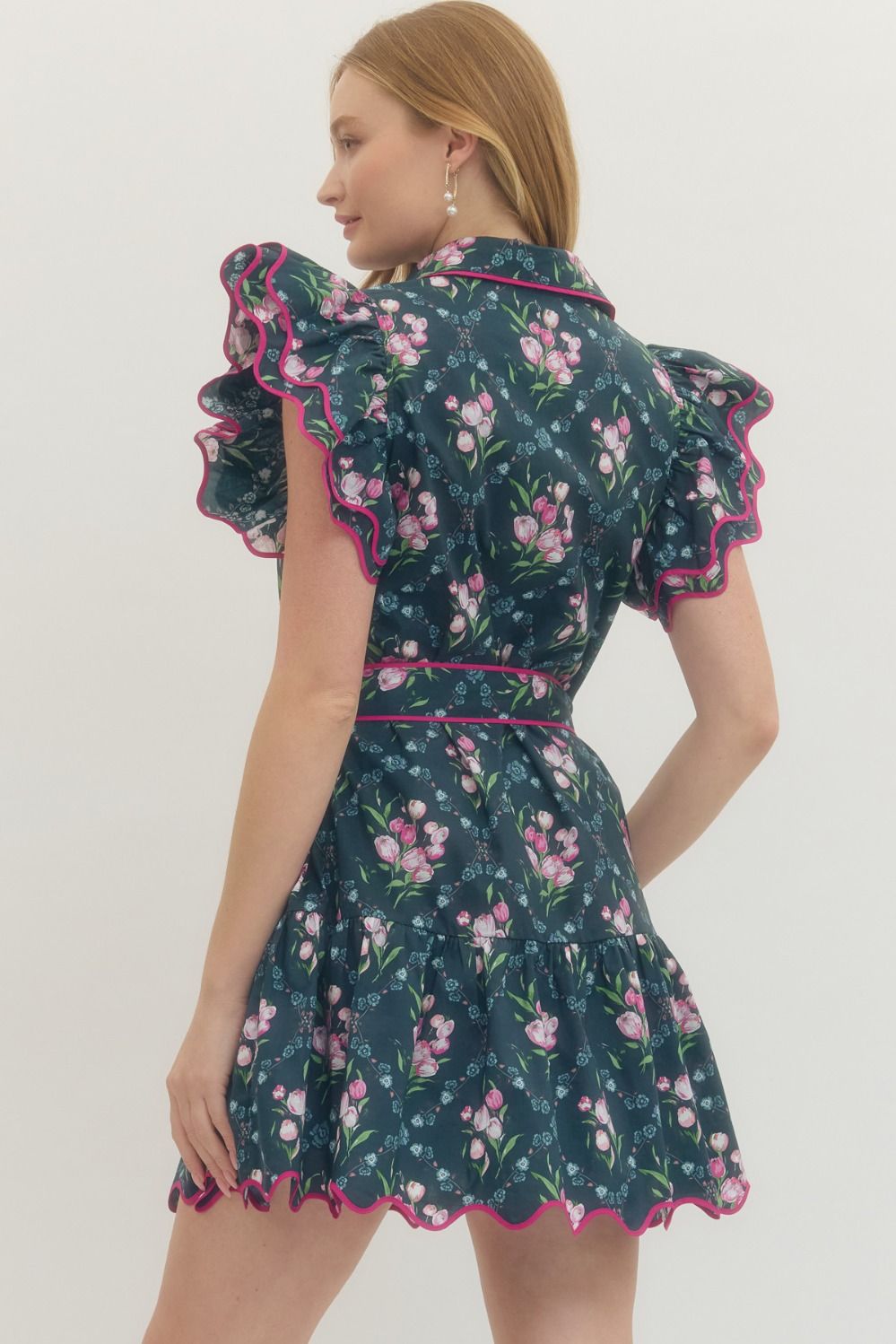 Women's navy button down dress with pink florals and hot pink scalloped trim by Entro showing back view