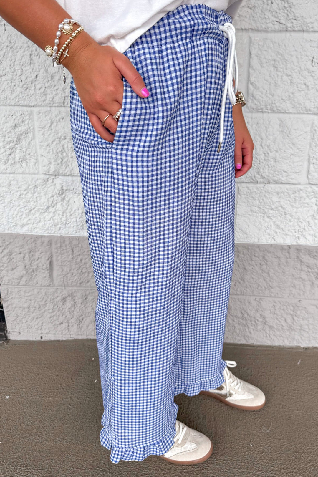 navy blue and ivory gingham checkered print ruffle hem wide leg pants with front pockets