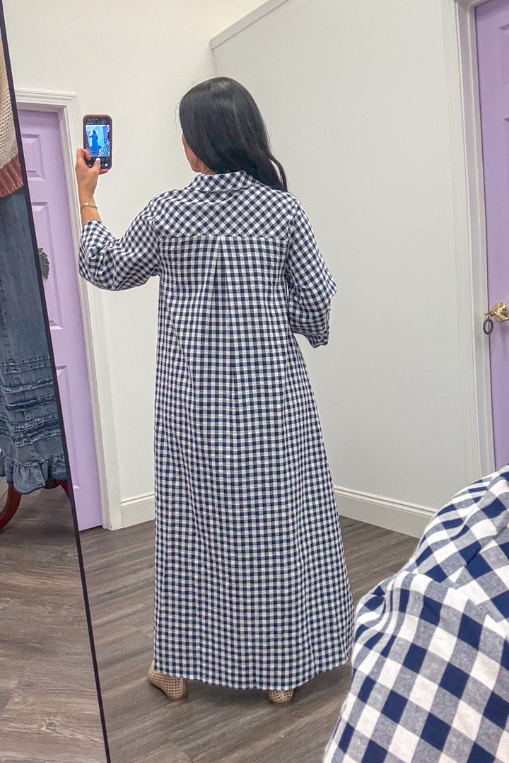 Back side of women's navy white gingham loose flowy maxi dress 