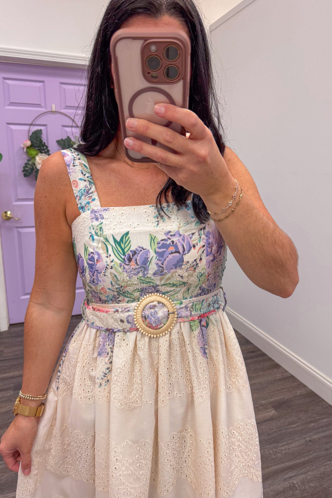 close up of cream eyelet sleeveless midi dress with lavender and teal floral