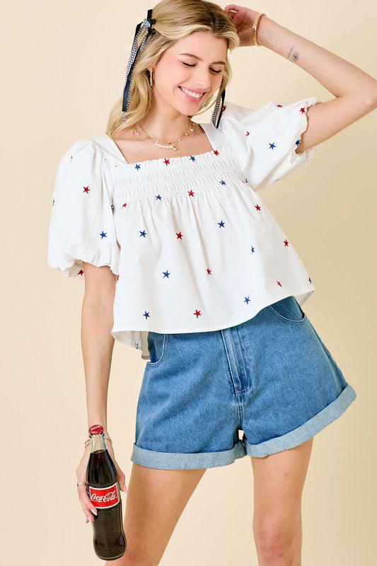 Day + Moon Off white poplin babydoll top with red and blue embroidered stars