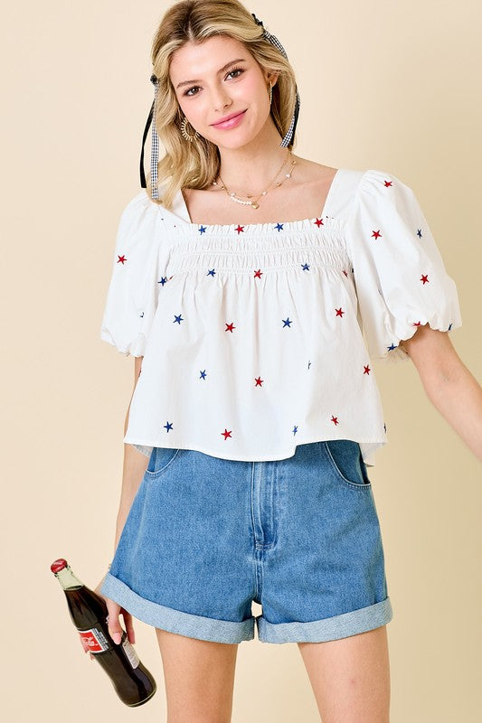 Day + Moon Off white poplin babydoll top with red and blue embroidered stars