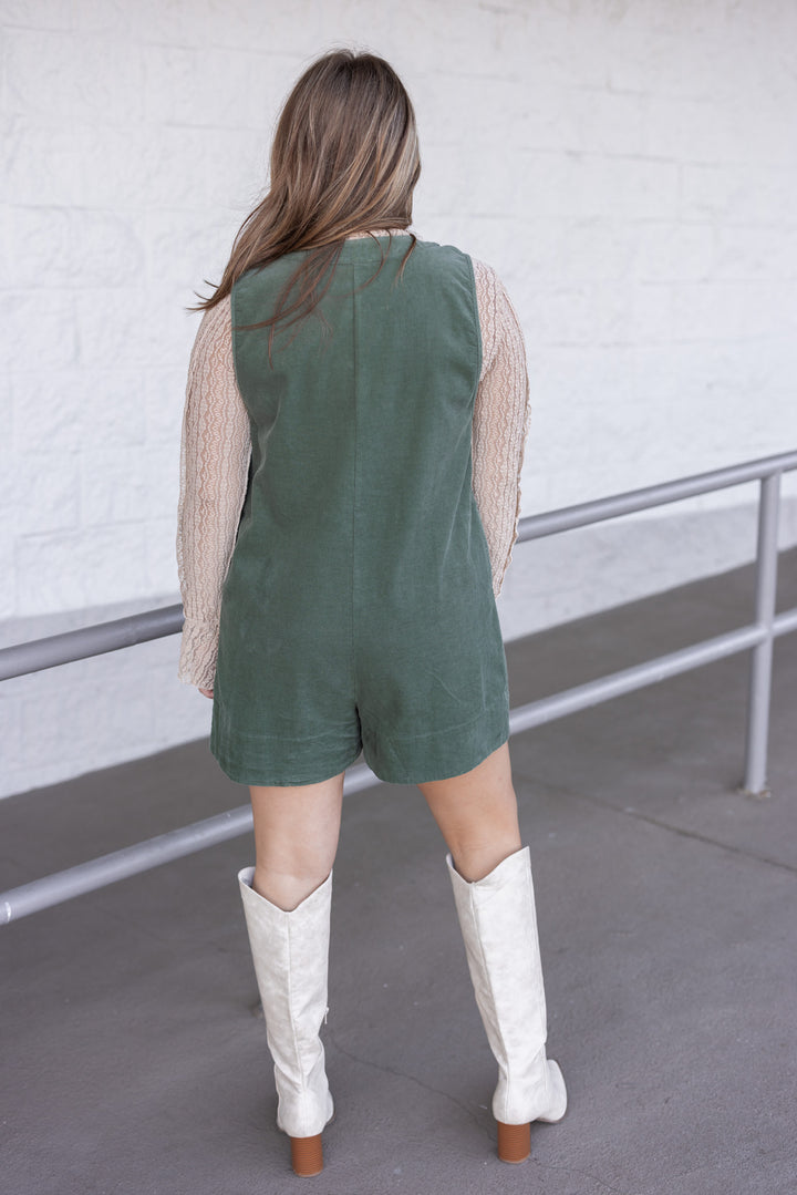 Women's olive green corduroy romper with ruched bodice and bow tie v neck by Wishlist showing full back view