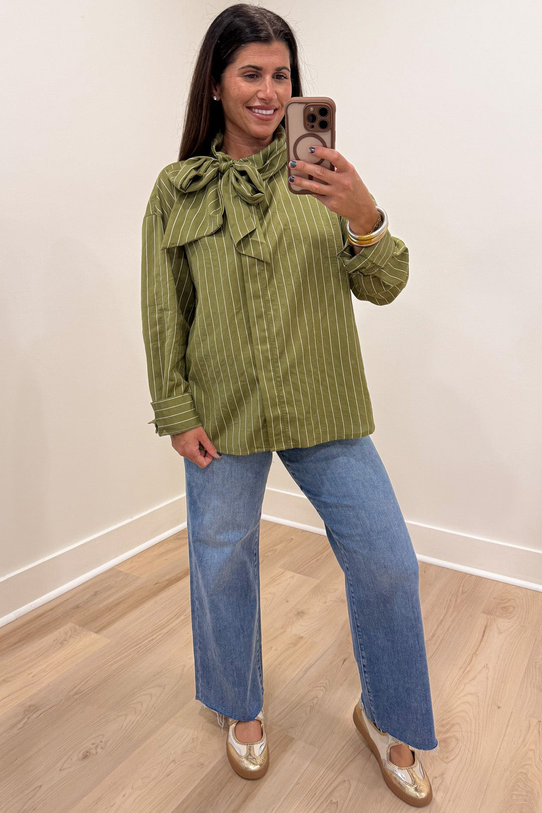 olive green and cream striped bow tie mock neck long sleeve flap covered button front top