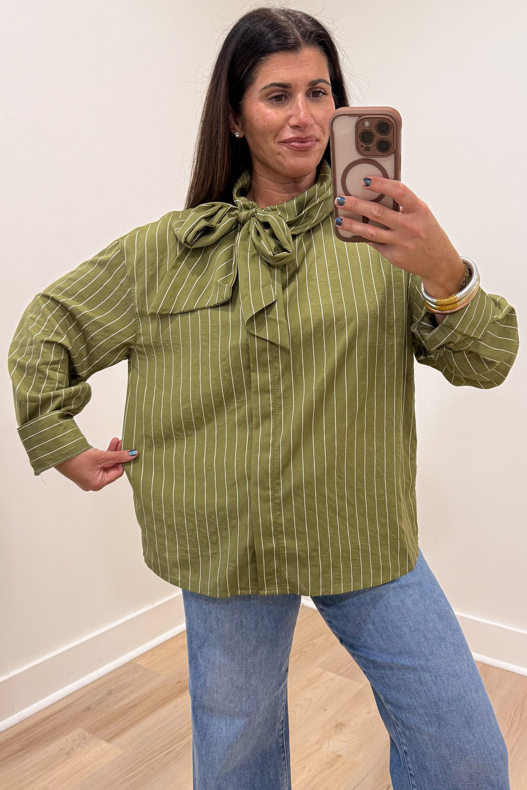 olive green and cream striped mock neck long sleeve flap covered button front relaxed silhouette top