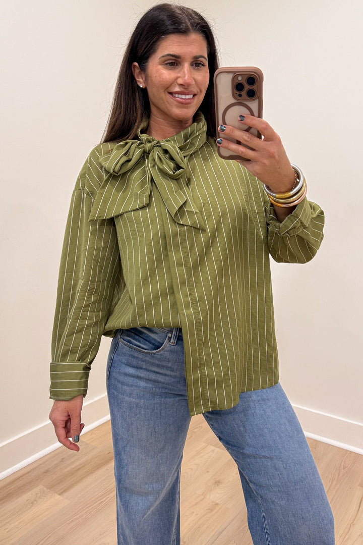 olive green and cream striped long sleeve flap covered button front top with adjustable bow tie mock neckline