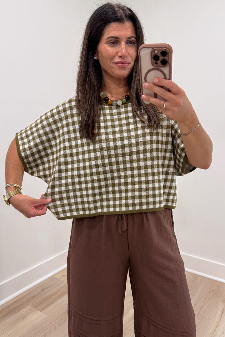 olive green and ivory gingham checkered print short sleeve relaxed silhouette semi-cropped knit top
