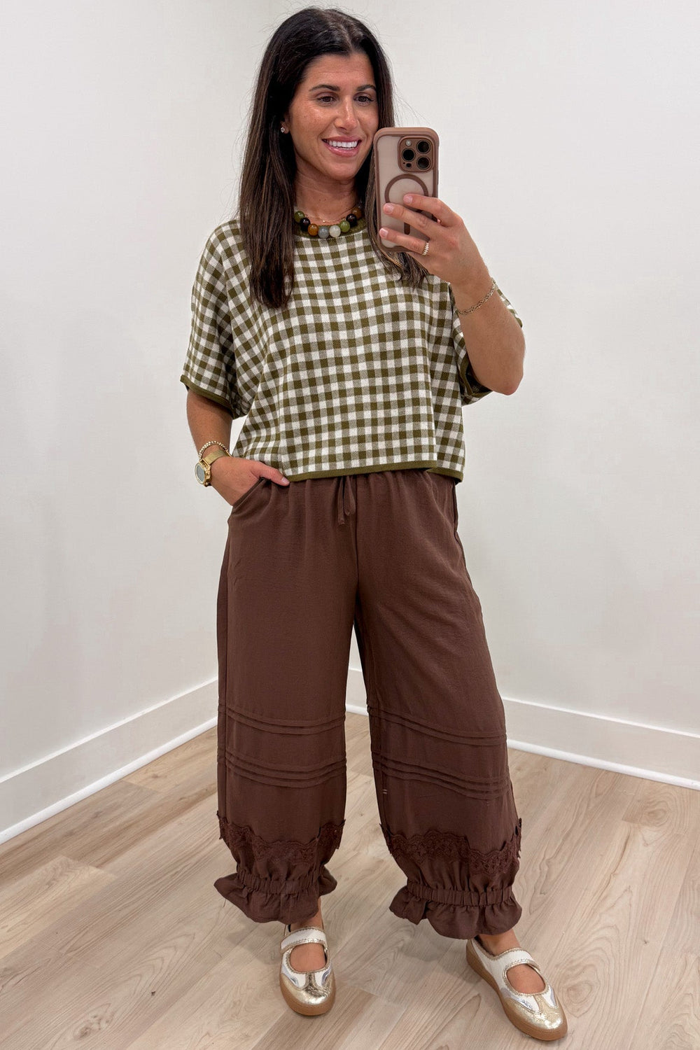 olive green and ivory gingham checkered print crew neckline short sleeve semi-cropped knit top