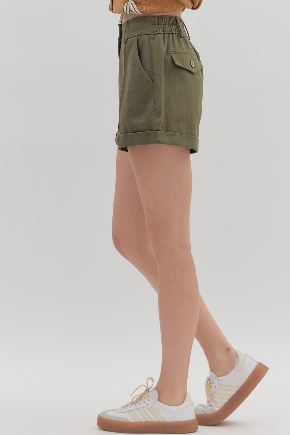 Women's olive denim pintuck shorts by Entro showing full side view