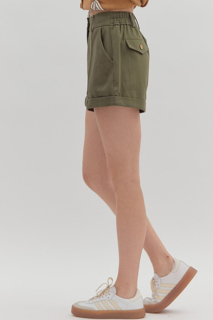 Women's olive denim pintuck shorts by Entro showing full side view