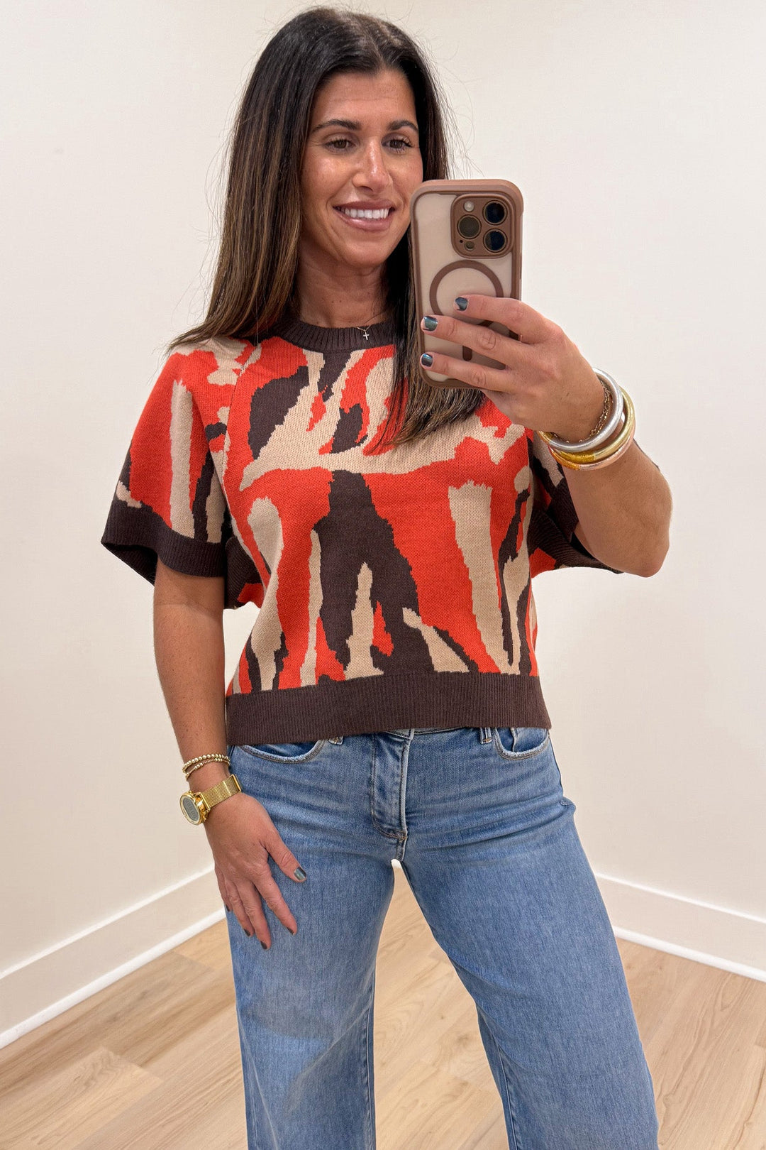 orange taupe and brown animal print crew neckline short sleeve knit sweater top