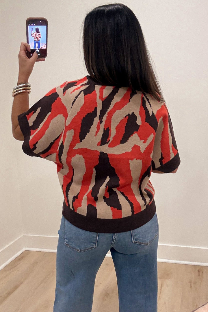orange taupe and brown animal print crew neckline short sleeve knit sweater top with ribbed trim