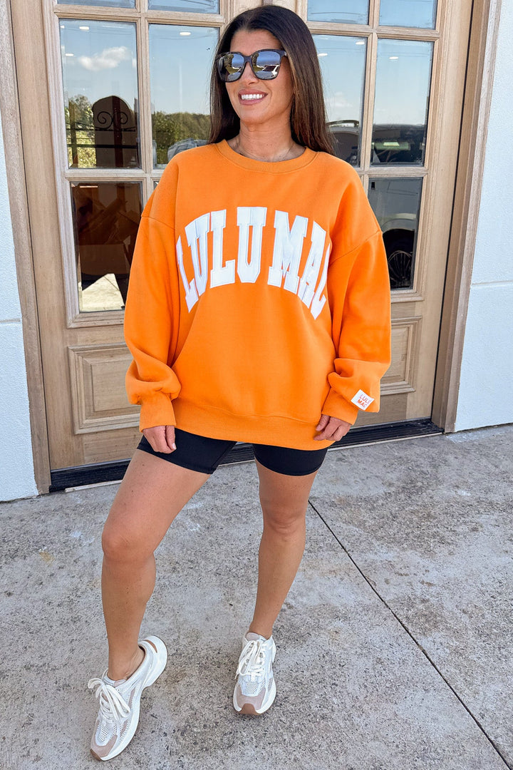 orange with white embroidered lulu mac long sleeve sweatshirt with ribbed trim