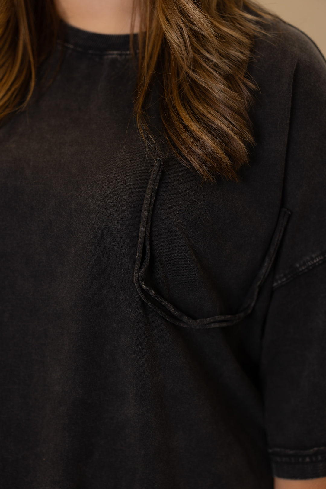 Women's mineral washed black oversized tee by Easel showing missing front chest pocket