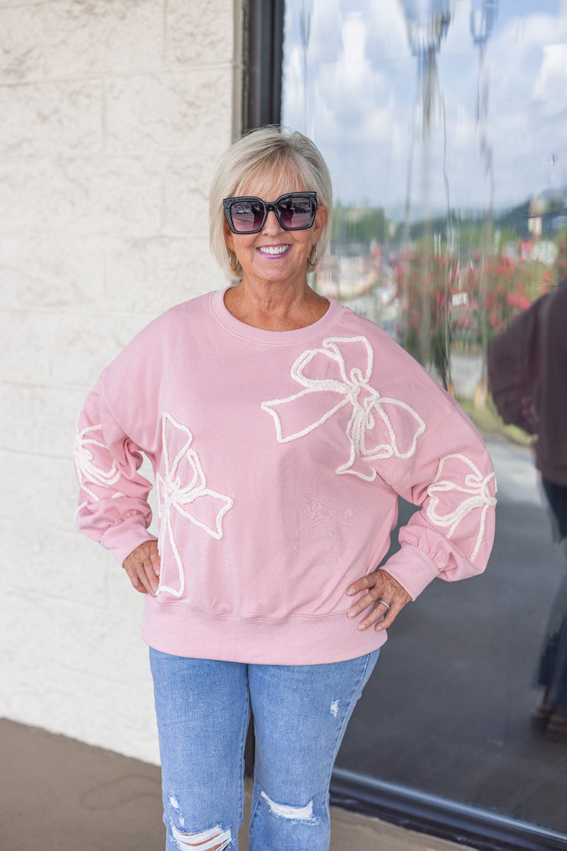 pink white stitched bow sweatshirt