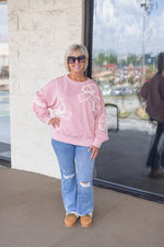 pink white stitched bow sweatshirt