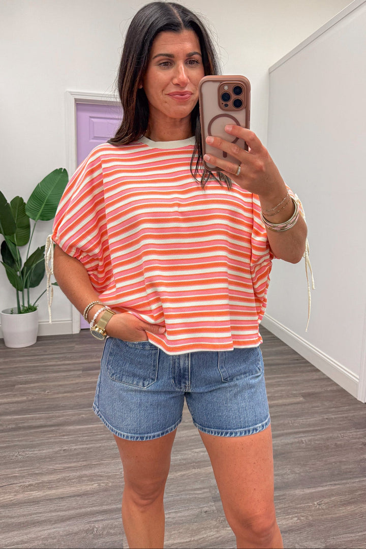 pink coral and cream striped short sleeve crew neckline knit top