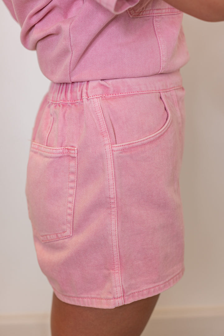 Bubblegum pink washed denim skort with wrap around style front by Wishlist showing side view